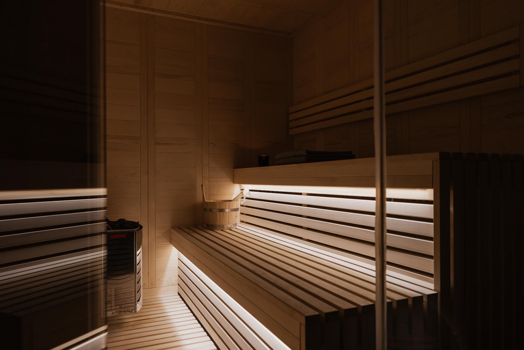 The quiet interior of the Moments Spa at Momi, warm wood and soft light