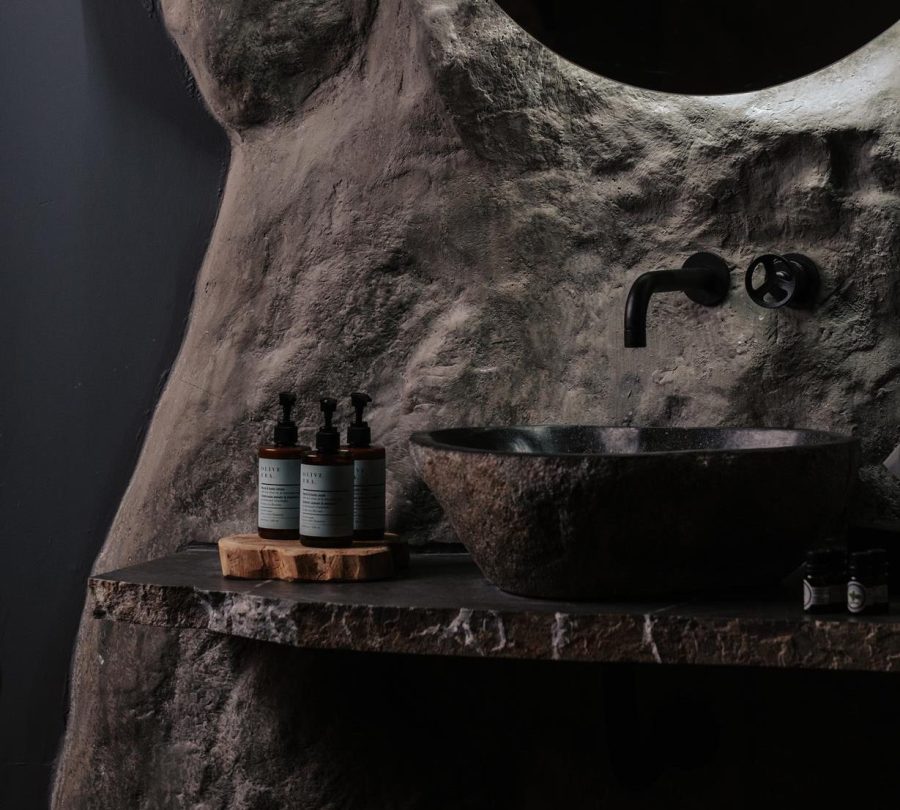 A stone-carved treatment alcove at Seaside’s Sea Cave Spa